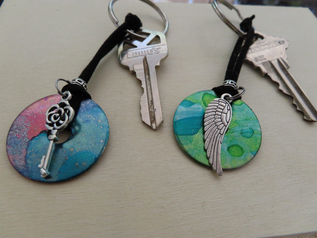 Colorful keychains with keys and charms.