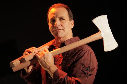 Man holding a double-headed axe confidently.