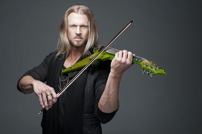 Person playing a green electric violin.