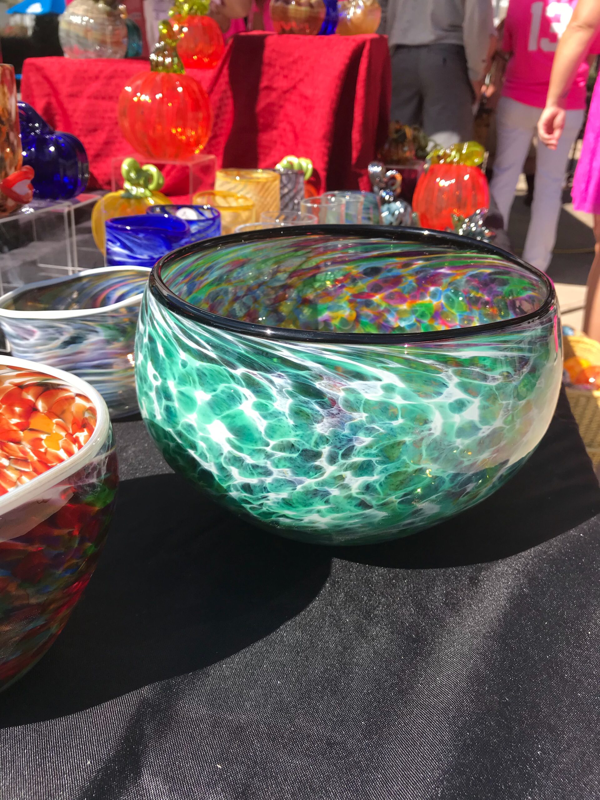 A bowl of candy is on the table.