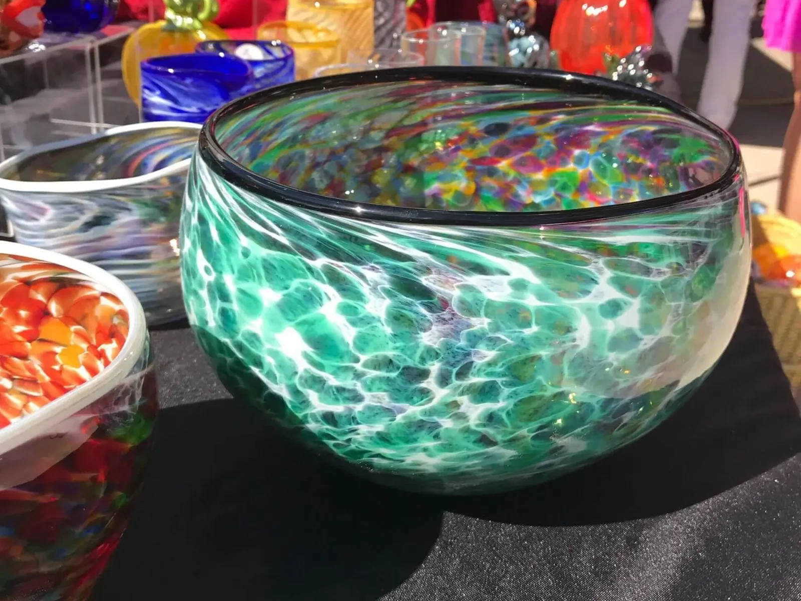 A bowl of candy is on the table.